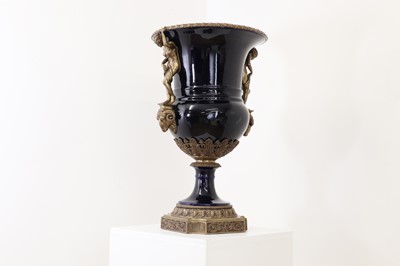 Lot 117 - A porcelain and bronze urn