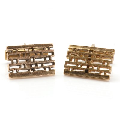 Lot 197 - A pair of pierced rectangular swivel link cufflinks, c.1970