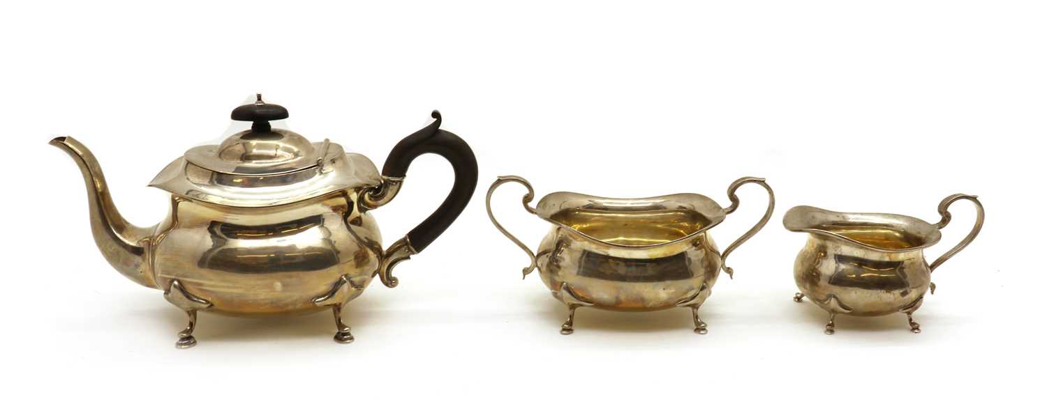 Lot 1 A silver three piece silver tea service