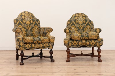 Lot 129 - A matched pair of Queen Anne-style walnut armchairs