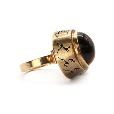 Lot 1083 - A South African gold single stone tiger’s eye ring