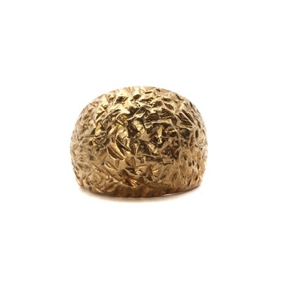 Lot 1092 - A 9ct gold textured bombé ring, c.1970