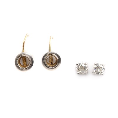 Lot 1046 - A pair of 18ct gold single stone diamond earrings