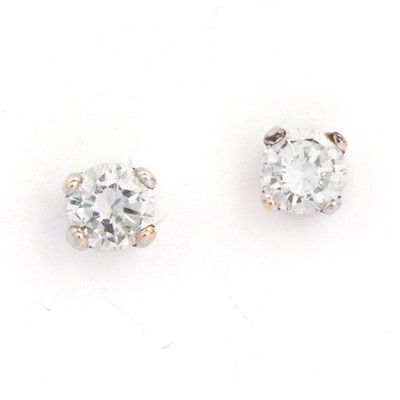 Lot 50 - A pair of 9ct two colour gold single stone diamond stud earrings