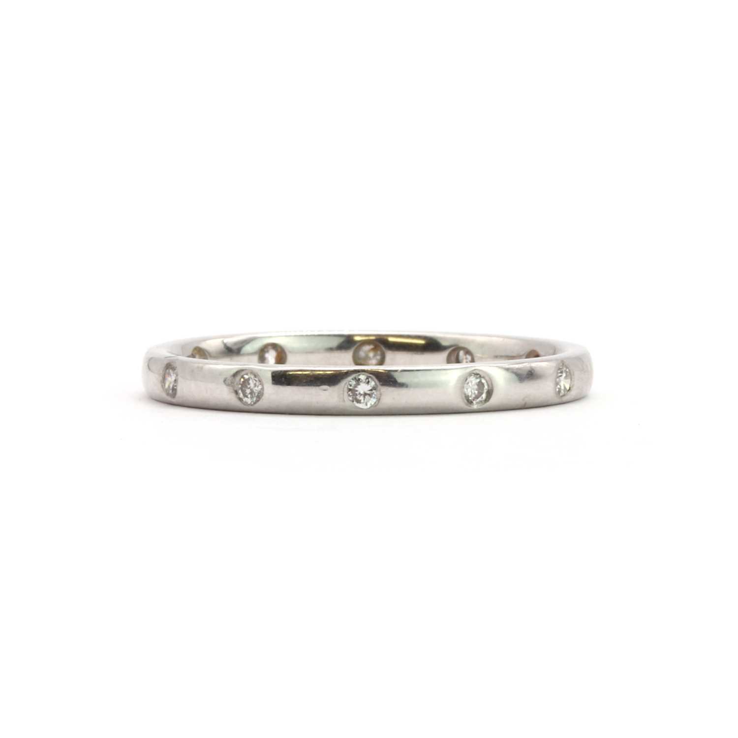 Gypsy Setting Diamond Lot 38 - An 18ct white gold diamond gypsy set wedding