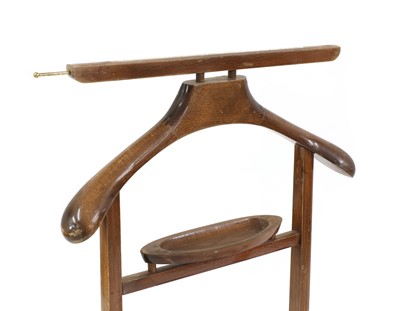 Lot 353 - A pair of Italian stained beech valet stands