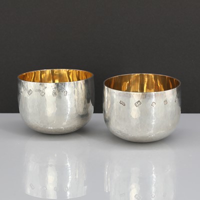 Lot 447 - A pair of silver beakers