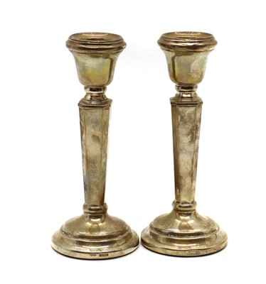Lot 9 - A pair of silver candlesticks