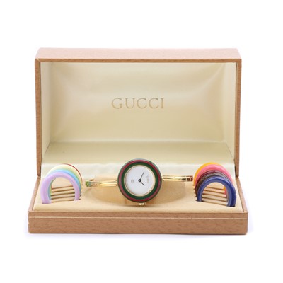 Lot 1430 - A ladies' gold plated Gucci quartz bangle watch