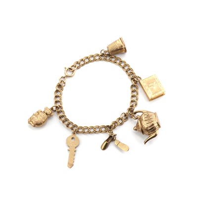 Lot 1507 - A gold charm bracelet