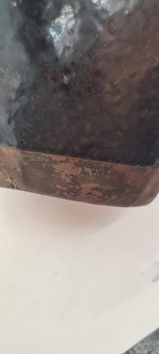 Lot 142 - A Chinese earthenware glazed water vessel