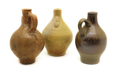 Lot 136 - Three stoneware bellarmine jugs