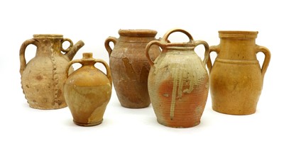 Lot 148 - Five earthenware and stoneware ewers and vessels