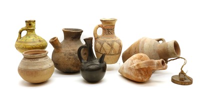 Lot 137 - A collection of seven antique vessels and jugs