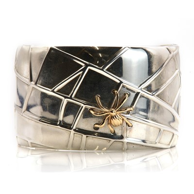 Lot 323 - A sterling silver and 18ct gold 'spider cuff' bangle, by Tiffany & Co. Ltd