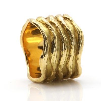 Lot 195 - A wavy gold 'sleeve' ring designed by K R Hooper of Hooper Bolton Ltd., c.1973, and made by Leo De Vroomen