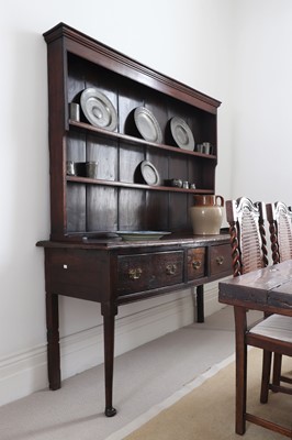 Lot 248 - An oak dresser base with associated plate rack