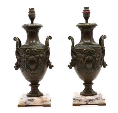 Lot 345 - A pair of spelter urn form table lamps