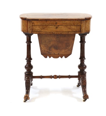 Lot 580 - A Victorian walnut work table