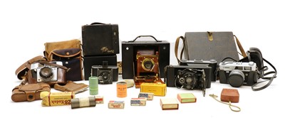 Lot 248A - An Eastman Kodak patinated brass and mahogany folding bellows camera