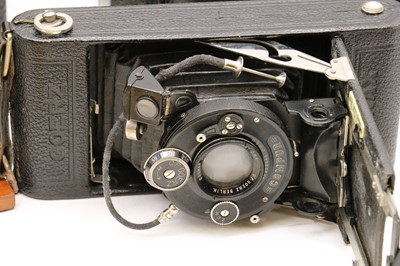 Lot 248 - An Eastman Kodak patinated brass and mahogany folding bellows camera