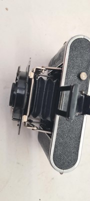 Lot 248 - An Eastman Kodak patinated brass and mahogany folding bellows camera