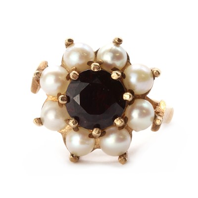 Lot 1196 - A 9ct gold garnet and cultured split pearl cluster ring