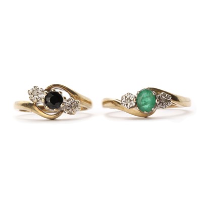 Lot 1527 - A 9ct gold three stone emerald and diamond ring