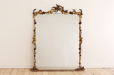 Lot 93 - A carved giltwood overmantel mirror in the rococo style