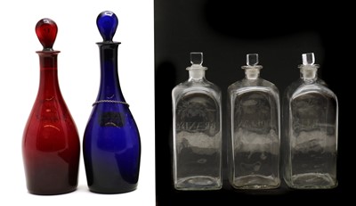 Lot 166 - A pair of coloured glass decanters