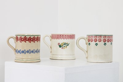 Lot 198 - Three spongeware mugs