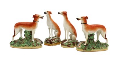 Lot 113 - A group of four Staffordshire pottery greyhounds