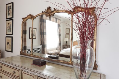 Lot 256 - A large giltwood overmantel mirror