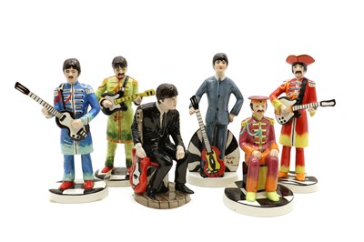 Lot 98 - A group of four Lorna Bailey pottery Beatles Sgt. Pepper figures