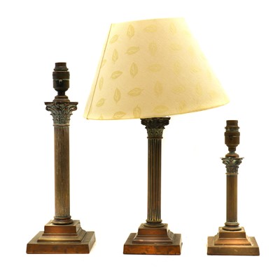 Lot 220 - A near graduated set of brass Corinthian column table lamps