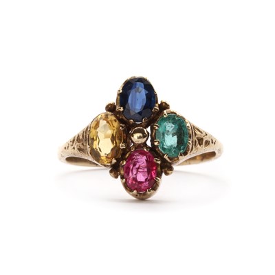 Lot 1205 - A gold gem set quatrefoil ring