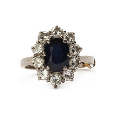Lot 116 - An 18ct white gold sapphire and diamond cluster ring