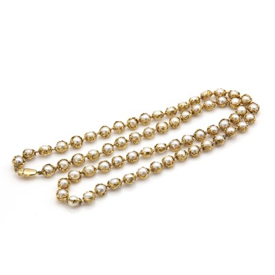 Lot 178 - An 18ct gold single row cultured pearl 'Wrapped' necklace, by Charles de Temple