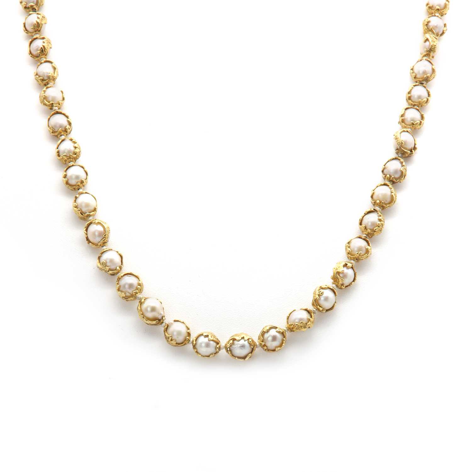 Lot 178 - An 18ct gold single row cultured pearl 'Wrapped' necklace, by Charles de Temple