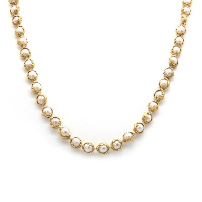 Lot 178 - An 18ct gold single row cultured pearl 'Wrapped' necklace, by Charles de Temple