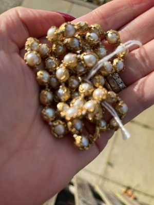 Lot 178 - An 18ct gold single row cultured pearl 'Wrapped' necklace, by Charles de Temple