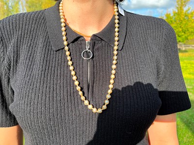 Lot 178 - An 18ct gold single row cultured pearl 'Wrapped' necklace, by Charles de Temple