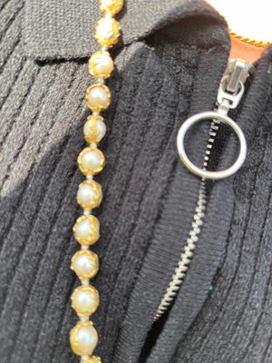 Lot 178 - An 18ct gold single row cultured pearl 'Wrapped' necklace, by Charles de Temple