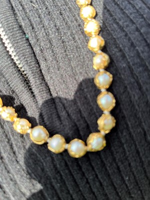 Lot 178 - An 18ct gold single row cultured pearl 'Wrapped' necklace, by Charles de Temple