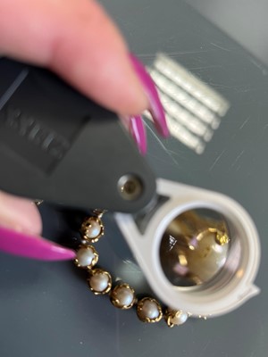 Lot 178 - An 18ct gold single row cultured pearl 'Wrapped' necklace, by Charles de Temple