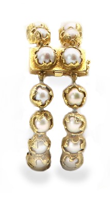 Lot 208 - An 18ct gold two row cultured pearl 'Wrapped' bracelet, by Charles de Temple