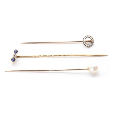 Lot 1064 - Three gold stick pins