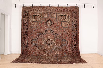 Lot 276 - A Persian Heriz wool carpet