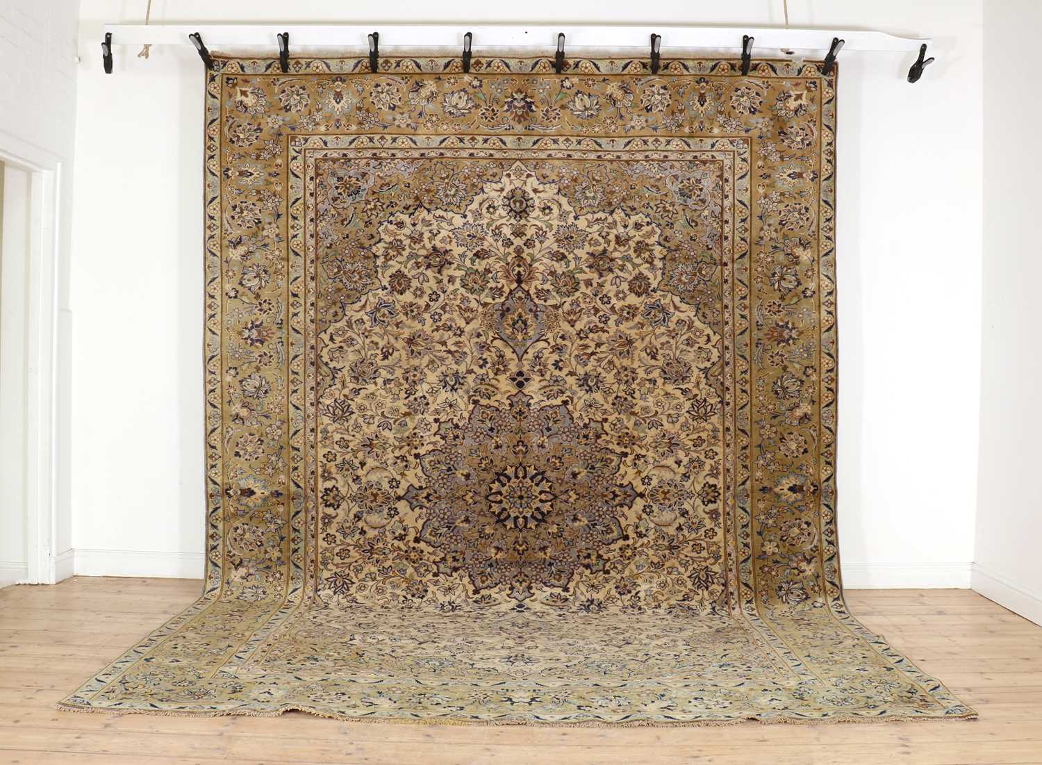 Lot 328 - A large Kashan carpet
