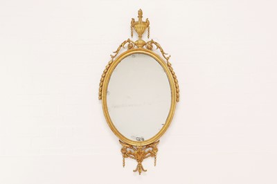 Lot 65 - A George III and later gilt-framed oval mirror